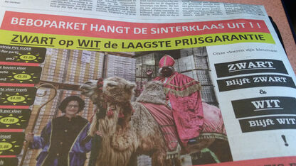 Ophef over merkwaardige Zwarte Piet-advertentie van parketbedrijf in Metro